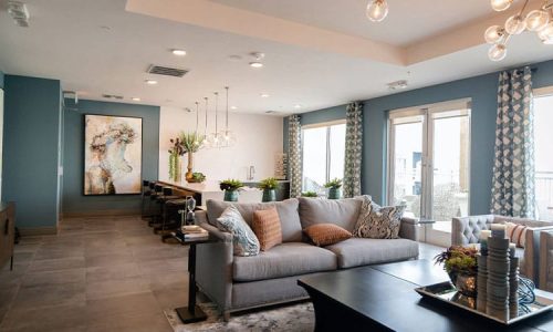 black-wooden-coffee-table-near-white-couch