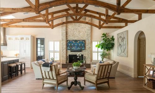 Bright and stylish living room featuring rustic wooden beams and modern design elements.