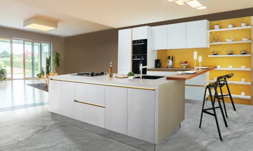 Sleek and modern kitchen interior featuring a large island and open shelving in a contemporary setting.