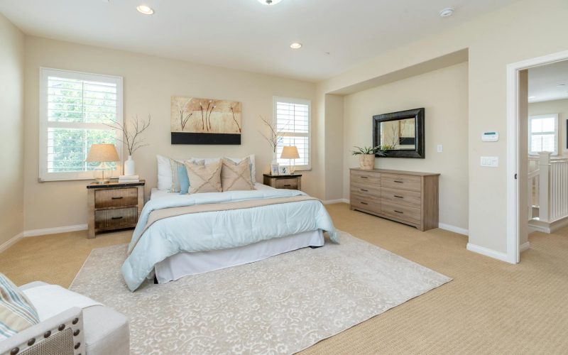 Bright modern bedroom with neutral decor and cozy ambiance, perfect for home decor inspiration.
