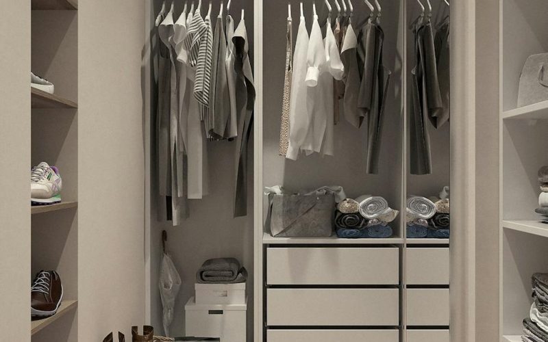 Stylish walk-in closet with neutral tones and contemporary design elements.